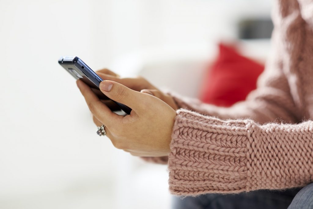 History of Text Messaging 1 Asian Girl Reading Sms On Smarthphone