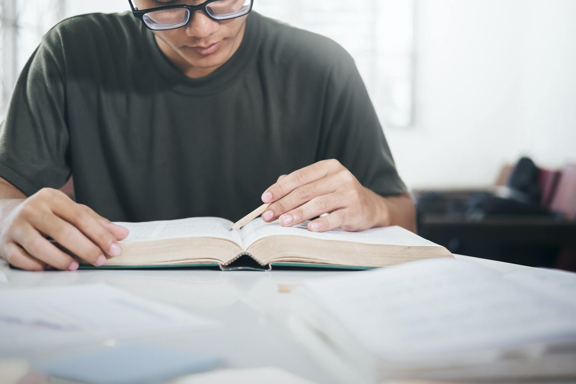How Text messaging is utilized in higher education? 1 reading a book education concept